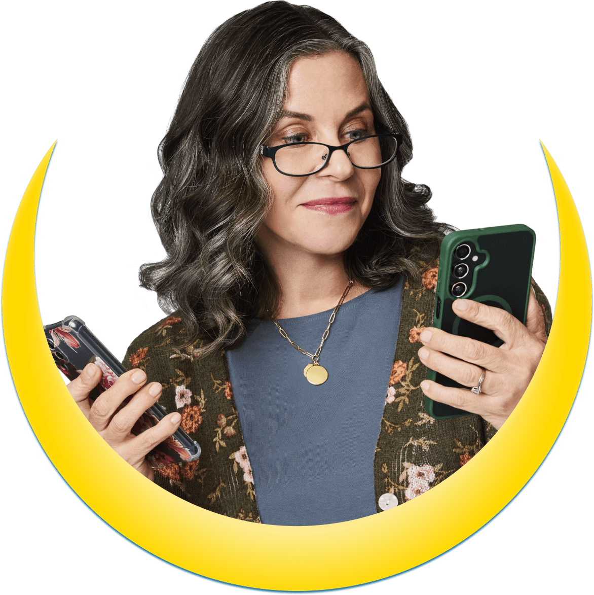 A woman holding two phones